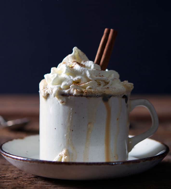 Homemade pumpkin spice latte in ceramic mug.