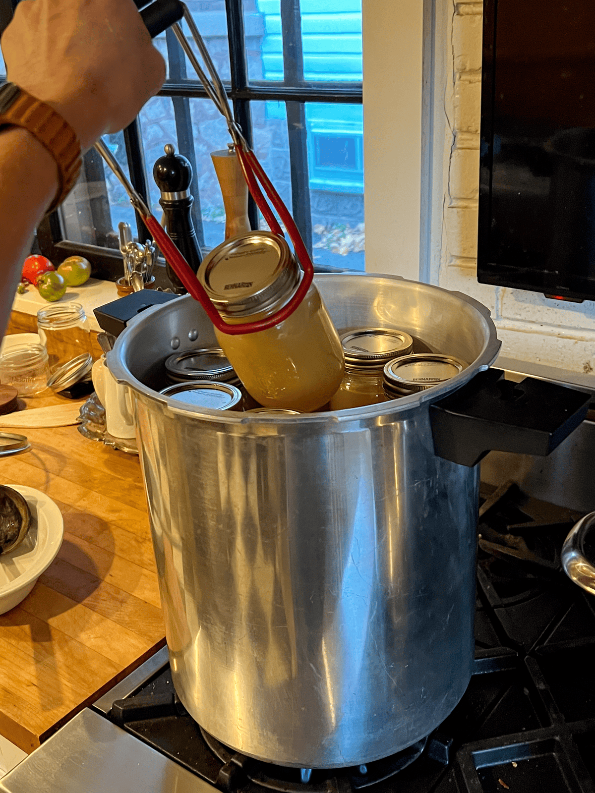 Pulling chicken broth out of Mirro pressure canner.